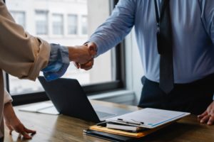 Men shaking hands at office: Sunbelt Selling Process: Expert Guidance & Support