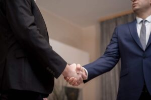 Businessmen shaking hands to seal a deal