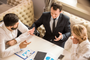 Business owner discussing tax planning and sale structure before selling a business