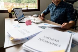 Business owner reviewing clean financial records before selling a business.